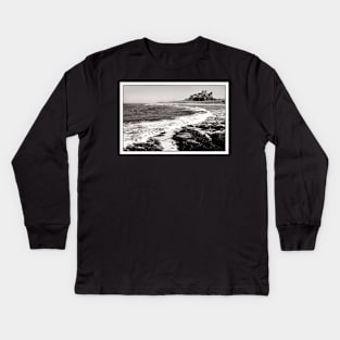 The coastline near Bamburgh Castle, Northumberland, UK Kids Long Sleeve T-Shirt